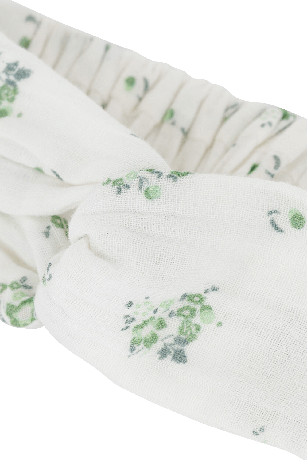 תמונת תקריב של סרט לשיער בלבן עם פרינט פרחוני